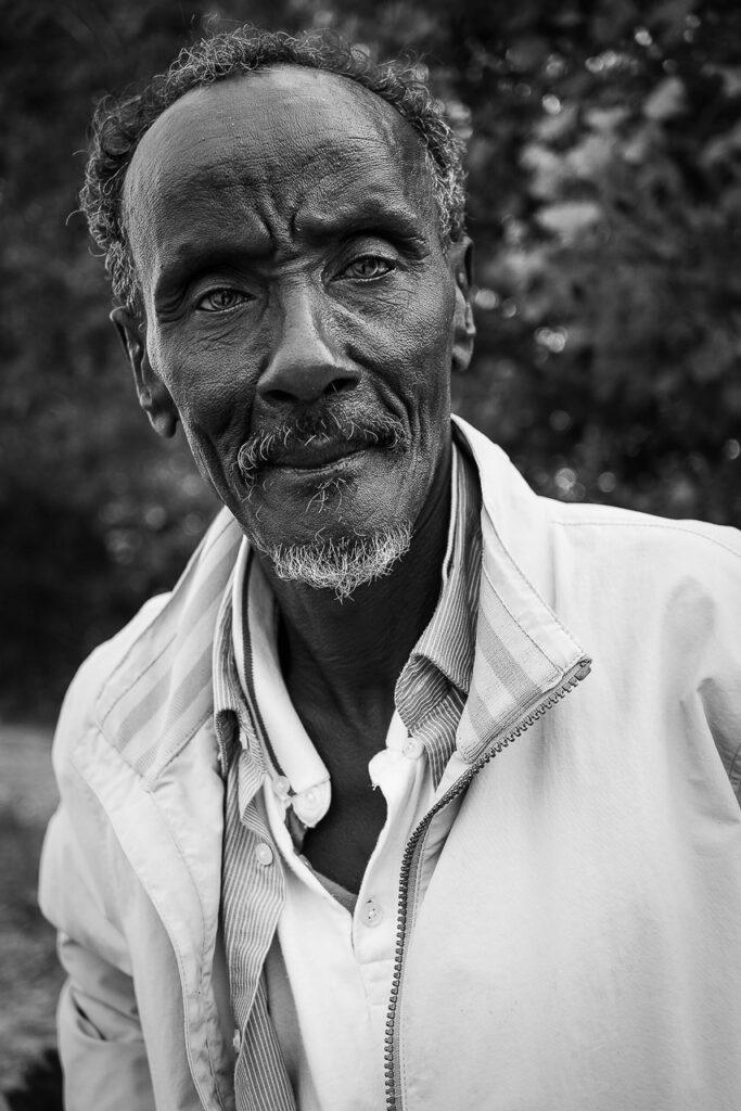 He is 80 years old, from Sudan, and no longer has a single tooth. He lives on the beach. “But at least here there is peace.” Emanuela Zampa Documentary photography, phtotojournalism, Genoa.