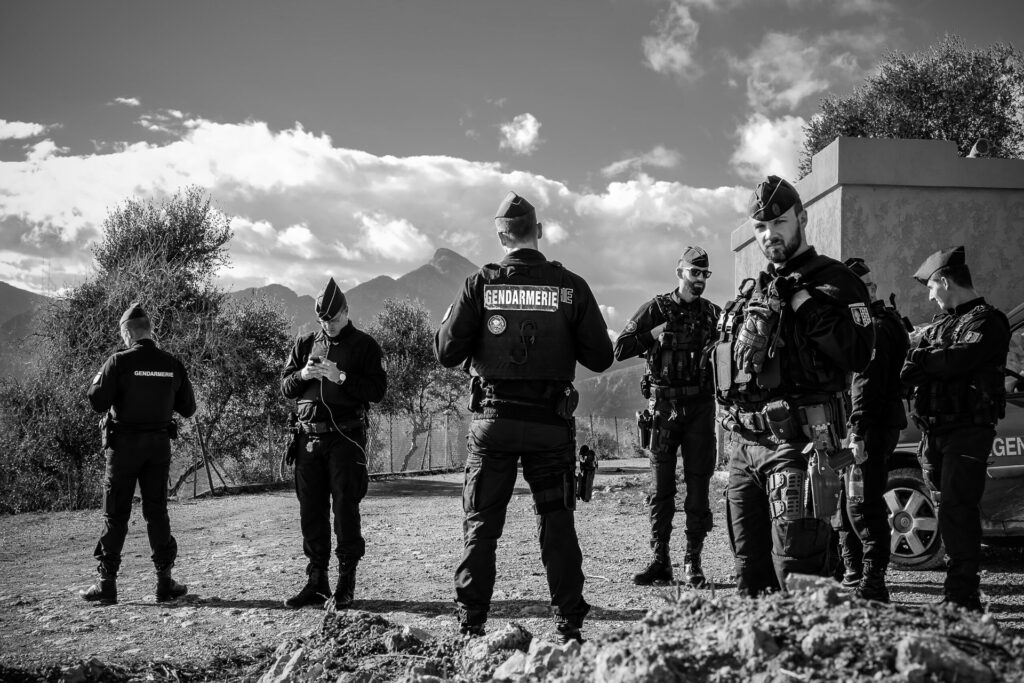 Italian-French border. French gendarmes confront a group of activists symbolically marching beyond the border crossing. Ventimiglia, 2018.