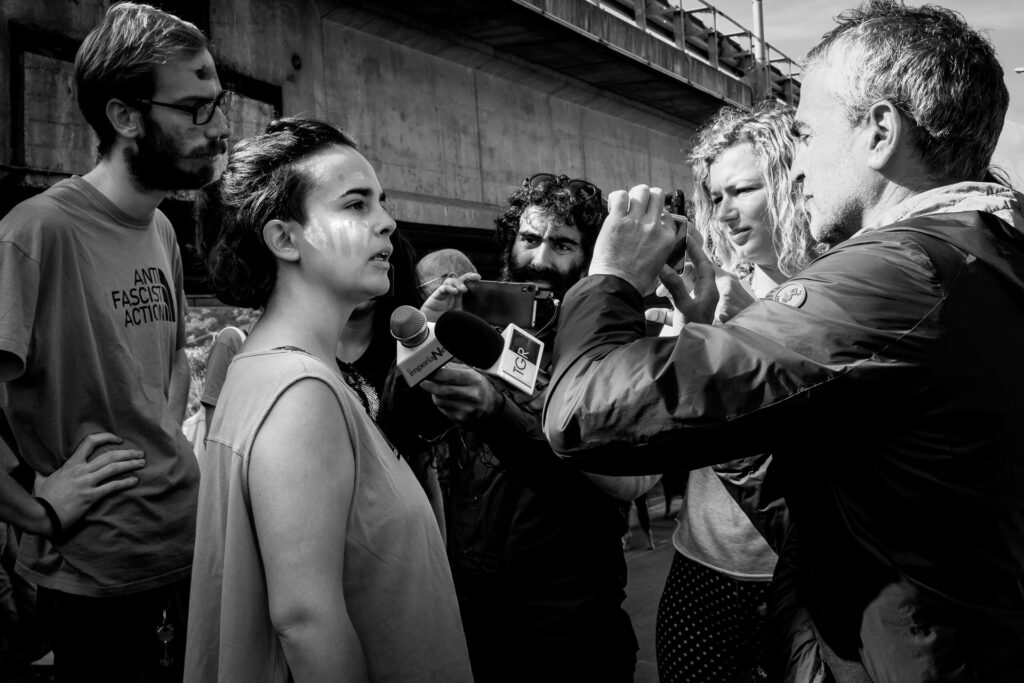 Activists speak to the press during the “Parade of Borderless Acrobats” in Ventimiglia, 2018.