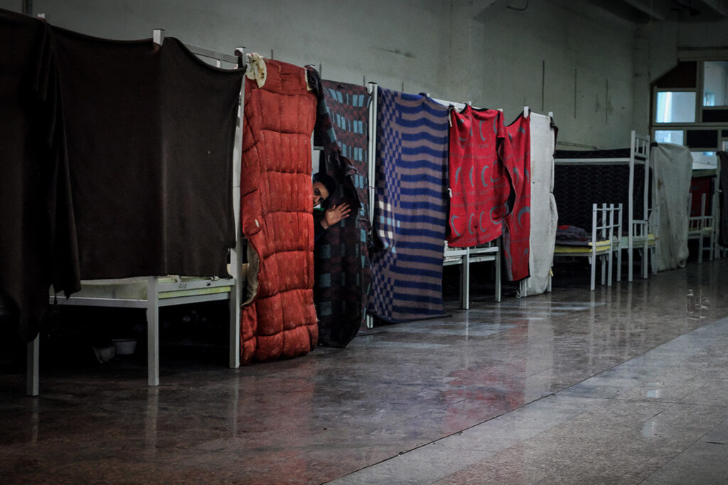 The Miral camp was also set up in an old factory. Spread over two floors, it hosts single men. Samir, a 32-year-old Algerian man, recounts his journey across half the Mediterranean. “I know the angel of death well, I am not afraid and I will not stop until I have crossed. I have no alternatives.” Miral Refugee Camp, Velika Kladuša, Bosnia and Herzegovina, 2019.