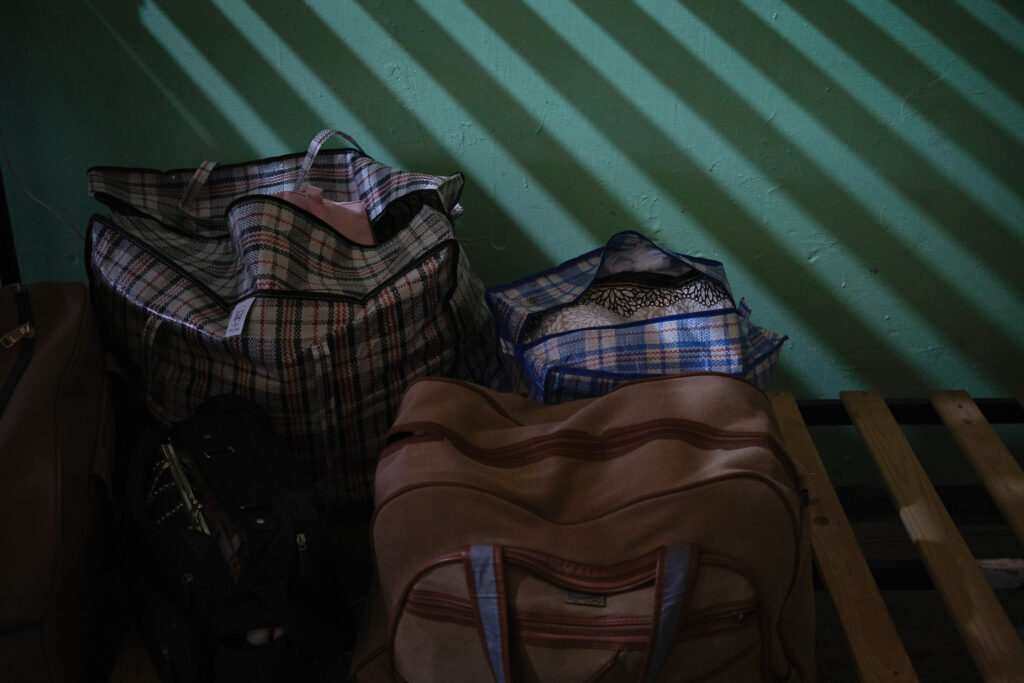 Belongings of refugees arriving from the border, seen inside a military facility in Chișinău, as a symbol of the universal condition of displacement. Chișinău, Moldova, March 21, 2022.