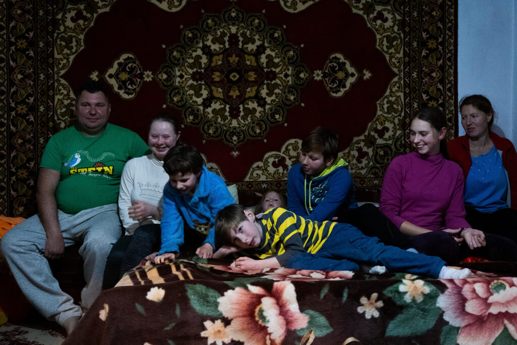 Alexei, Marina and their six children are a family of Ukrainian refugees who have found hospitality in the home of Vicislav, a Moldovan farmer. Saiti, Moldova, 19 March 2022.