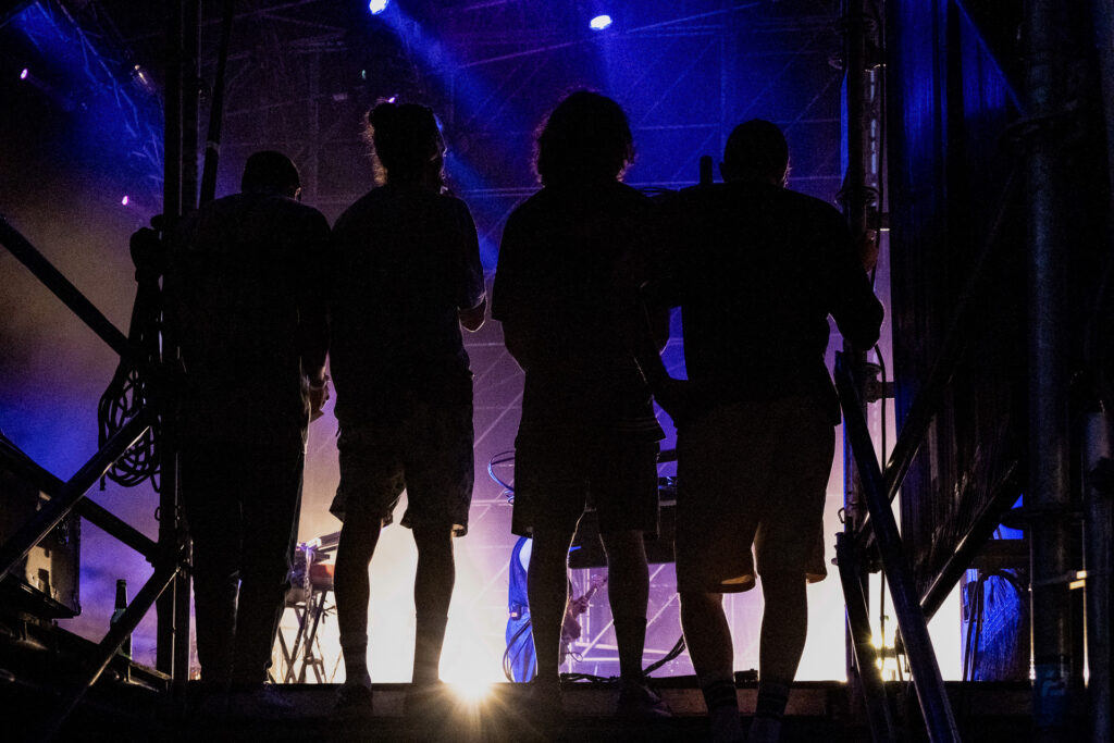 Technicians, backliners and stagehands wait for the show to end before beginning the overnight dismantling of the stage. Padua, July 7th 2022, Sherwood Festival.