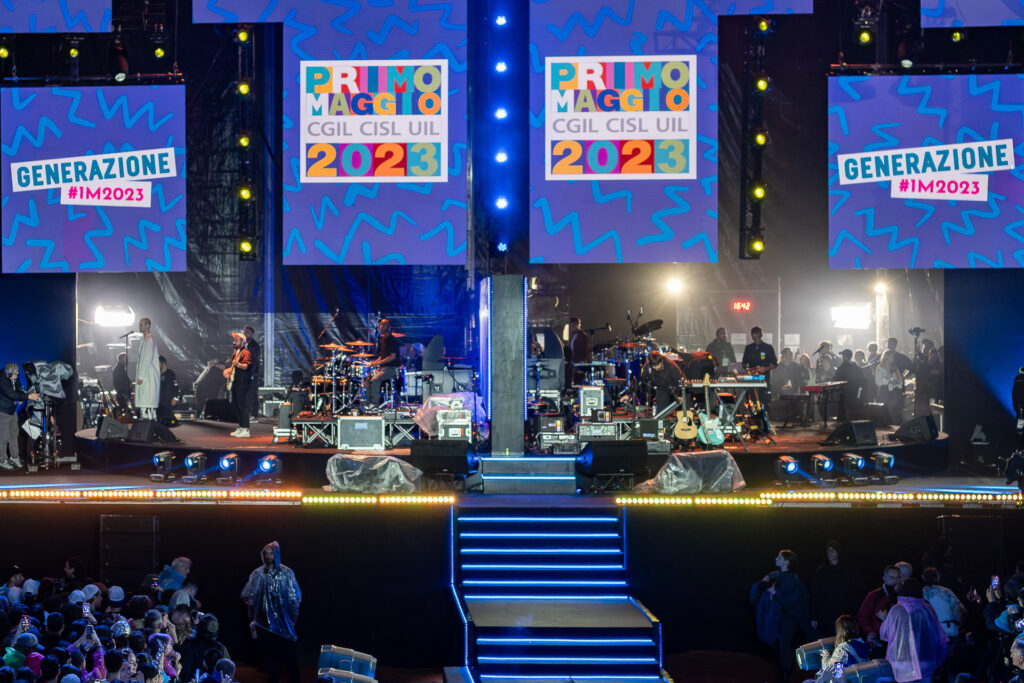 An overview of the stage of Rome’s Primo Maggio concert. During the nine-hour live broadcast, artists perform one after another on a rotating stage system that allows technicians to prepare the next setup behind the scenes while another performance is taking place in front of the audience. Rome, May 2023.