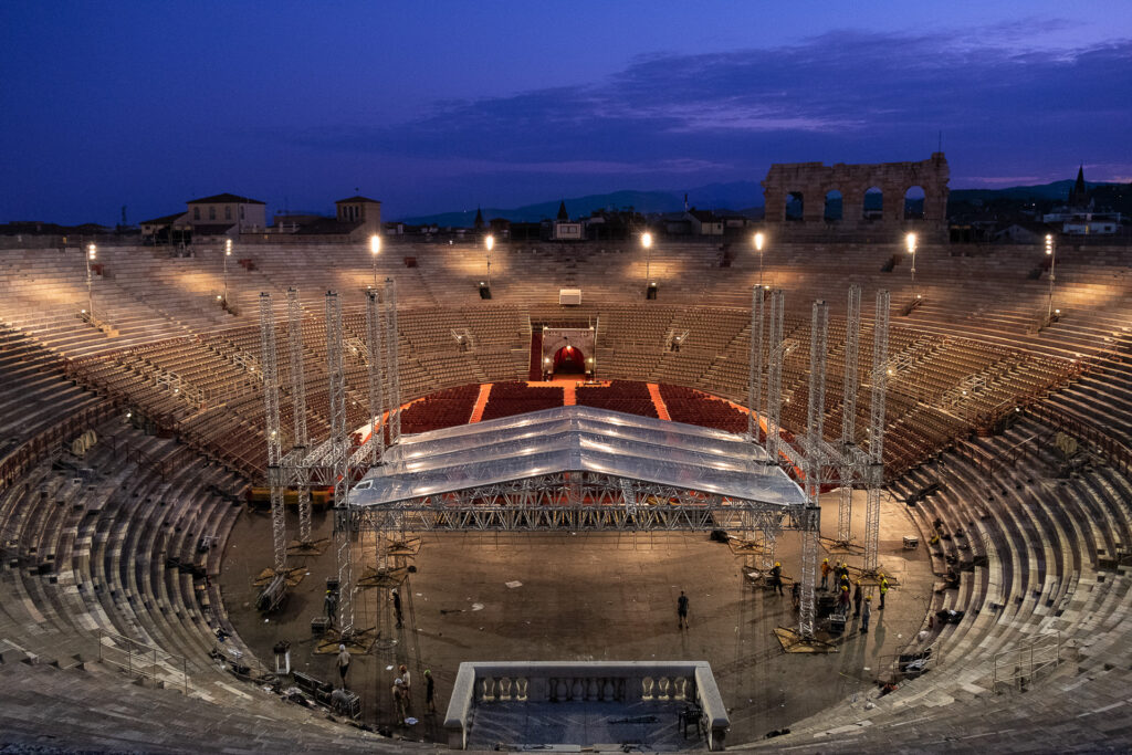At dawn, the Space Roof structure inside the Arena di Verona is almost completely dismantled. While the audience has long gone home, the crews continue working through the night to take apart the stage and technical structures that made the show possible. Arena di Verona, July 2022.
