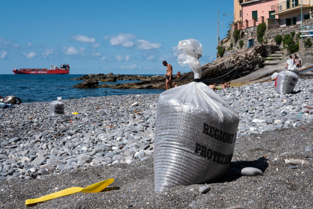 Genoa, Quinto al Mare public beach. Detail of sand-filled bags used by civil protection to divide the beach into sections in accordance with social distancing rules imposed during the Covid-19 pandemic. Genoa, May 28th 2020.