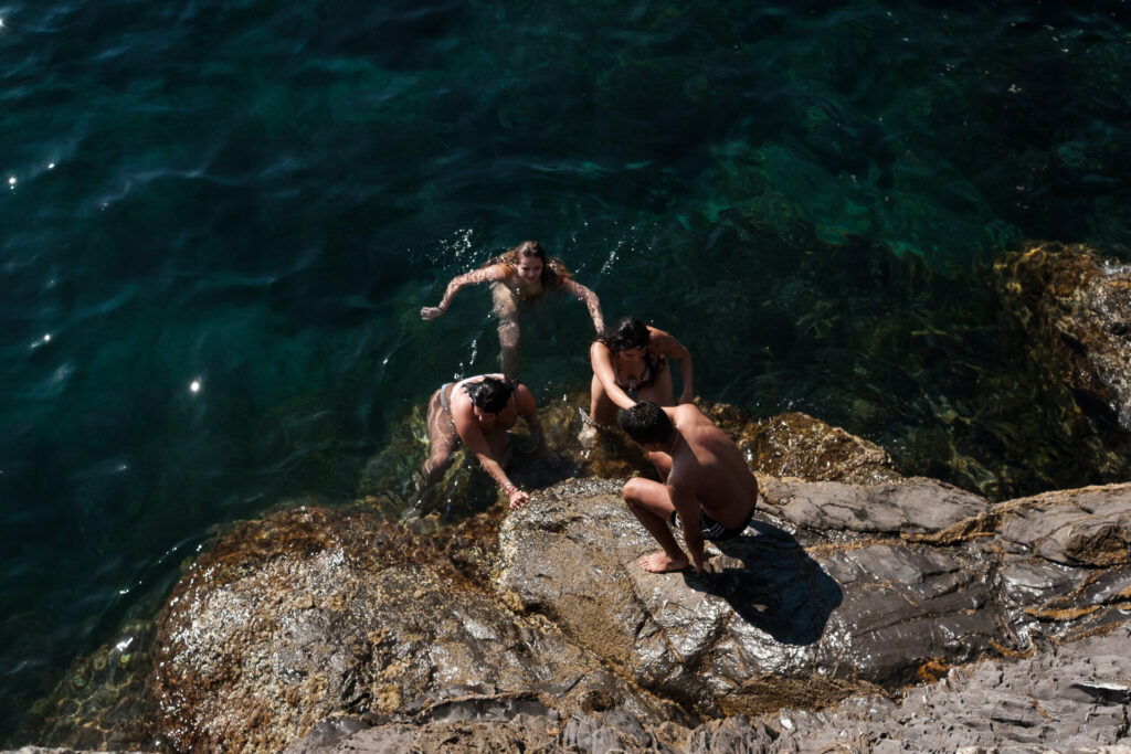 Kids dive from the Pier in the Quinto district. Genoa, June 2nd, 2020.